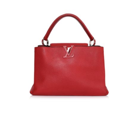 A LOUIS VUITTON RED CAPUCINES MM HANDBAG
Clemence leather in red, featuring a signature LV logo plaque, and single top handle
