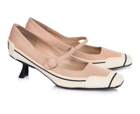 A PAIR OF CHRISTIAN DIOR 'D-MOTION' PUMPS
Beige knit upper, white rubber cap toe and sole with black detailing, slim Mary Jan
