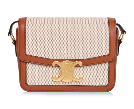 A CELINE TEEN TRIOMPHE CROSSBODY BAG BY HEDI SLIMANE
Canvas body with brown calfskin trim, adjustable leather shoulder strap,