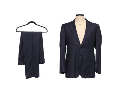 A BERLUTI 'TORTONA' NAVY SUIT
Single breasted jacket with two horn buttons, 'Classic Fit' with constructed shoulders, two fro