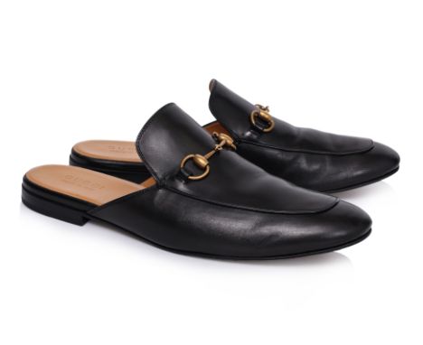 A PAIR OF GUCCI LEATHER 'PRINCETOWN' HORSEBIT MULES
Black calfskin upper, gold-tone Horsebit hardware, almond toe, and a flat