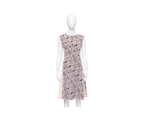 A LOUIS VUITTON FLORAL LACE DRESS BY NICOLAS GHESQUIÈRE
Lilac lace overlay with off-white contrast side panels, black insert 