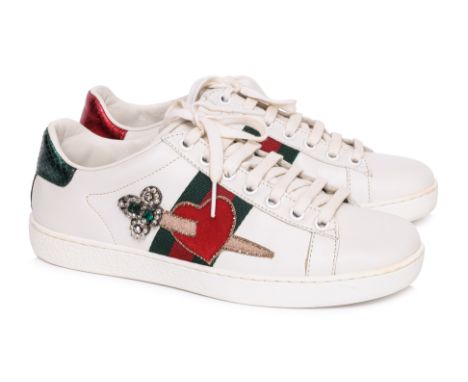 A PAIR OF GUCCI ACE EMBROIDERED SNEAKERS
White leather featuring a signature web stripe with an embroidered heart and dagger 