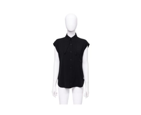A BALENCIAGA BLACK SCARF-COLLAR BLOUSE
With exaggerated point collar
Size 36
Ownership Statement: This item is offered for sa