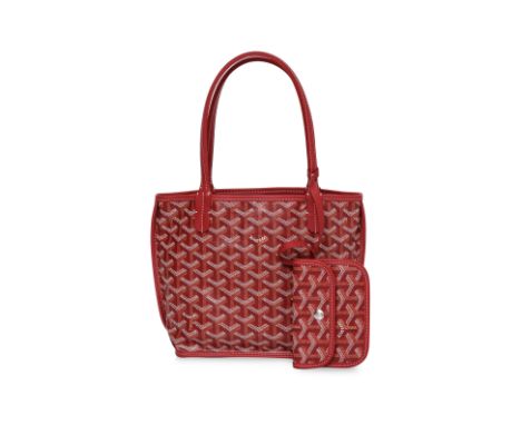 A GOYARD SAC ANJOU MINI ROUGE
Coated canvas featuring the signature chevron print, dual leather shoulder straps, and tonal le
