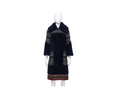 A LOUIS VUITTON TWO-TONE WOOL COAT
With navy plush teddy wool panels and striped accents, detachable faux-fur collar, wide sl