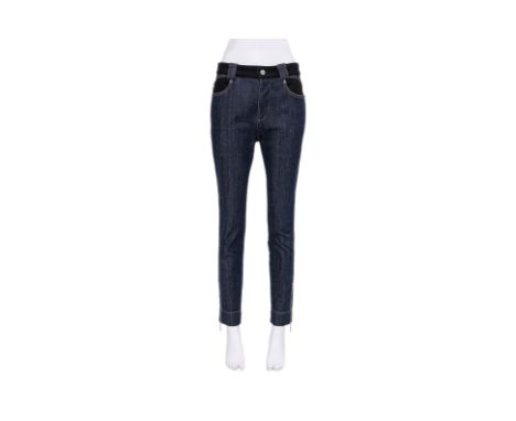 A PAIR OF LOUIS VUITTON DARK WASH JEANS
With a contrast black waistband, buttoned coin pockets, contrast stitching, tapered l