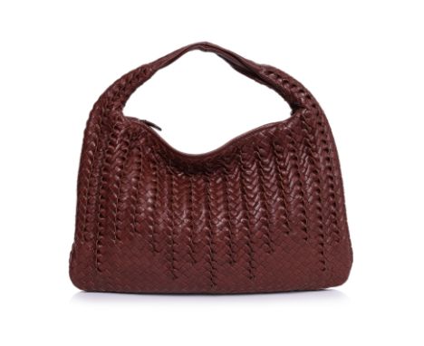 A BOTTEGA VENETA BROWN TOURNABINI HOBO BAG
Signature Intrecciato weave, gunmetal hardware, single rolled handle, suede-lined 