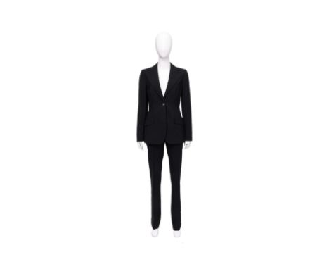 A DOLCE & GABBANA BLACK SUIT SET
Single-breasted featuring structured shoulders, peak lapels, a single button closure, flap p