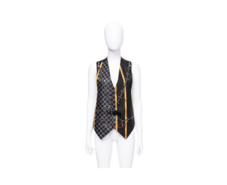 A LOUIS VUITTON LAMBSKIN STUDDED VEST BY NICOLAS GHESQUIÈRE
With yellow racing stripes, silver-tone zippers, studded trims, a