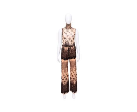 A JEAN PAUL GAULTIER 'TATTOO' PRINT MESH ENSEMBLE
Circa 1990's, including a sleeveless top with a high ruched turtleneck, and