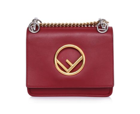 A FENDI RED LEATHER MINI KAN SHOULDER BAG
Featuring a gold-tone logo plaque, chain-link shoulder strap with leather reinforce