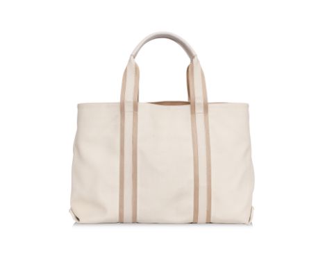 A BOTTEGA VENETA MARCO POLO TOTE BAG
PVC coated canvas with striped webbing handles, snap-buttons to sides, internal zip pock