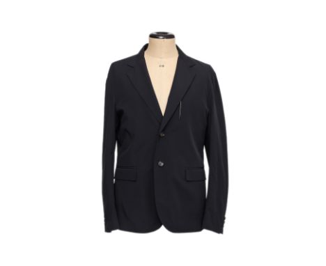 A LOUIS VUITTON NAVY REVERSIBLE NYLON JACKET
Featuring a two-button front, notch lapels, and flap pockets, fully reversible w