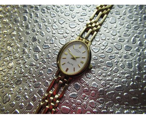 Ladies Rotary Elite 9ct gold quartz wristwatch oval case on gate style bracelet case back and clasp stamped 9K. Snap off case
