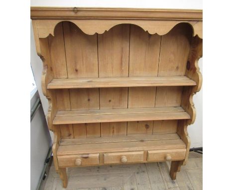 Waxed pine three tier wall rack, moulded cornice and three spice drawers with turned wooden handles, W86cm D17cm H111cm 