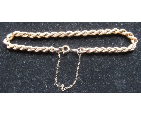 9ct yellow gold rope twist bracelet with safety chain and spring ring clasp stamped 9ct, L20cm, 4.8g 