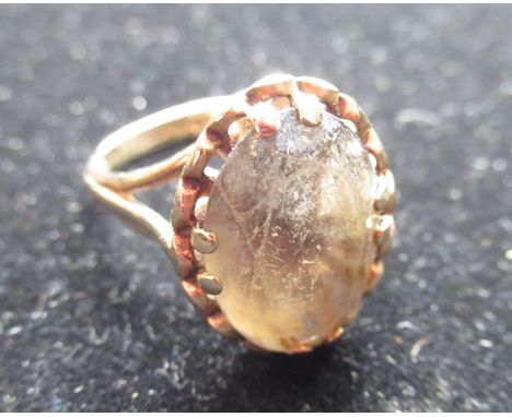 Hallmarked 9ct yellow gold Smokey quartz ring with an oval cut, claw set smoky quartz by L&amp;S, Edinburgh, 1975 size M, gro