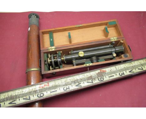 Troughton &amp; Simms of London black japanned metal theodolite, in fitted mahogany case with brass bound mahogany tripod and