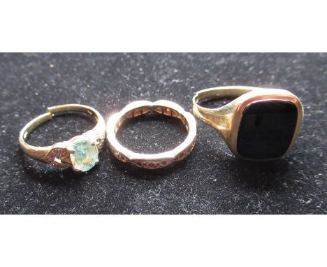 9ct yellow gold eternity ring set with white stones (AF), 9ct yellow gold and onyx signet ring (AF) and a 9ct yellow gold rin