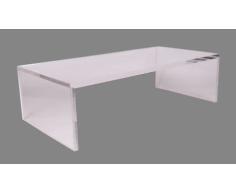 A modern design clear Carew Jones Blade acrylic coffee table, 140 by 70 by 40cms high.Condition ReportThe surface has some li