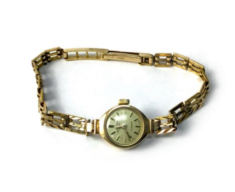LADY'S ROTARY NINE CARAT GOLD MANUAL WIND COCKTAIL WATCH, the round dial with applied baton hour markers, gold hands, 14mm ca