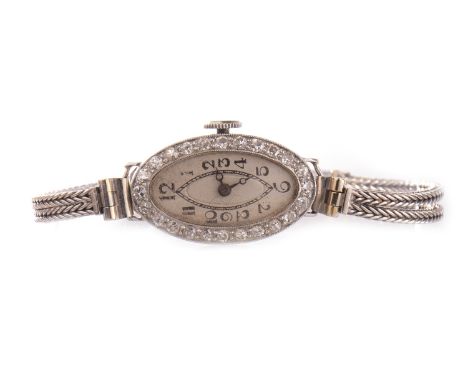 LADY'S ART DECO DIAMOND SET MANUAL WIND COCKTAIL WATCH, unsigned movement, the oval dial with Arabic numerals in black, inner