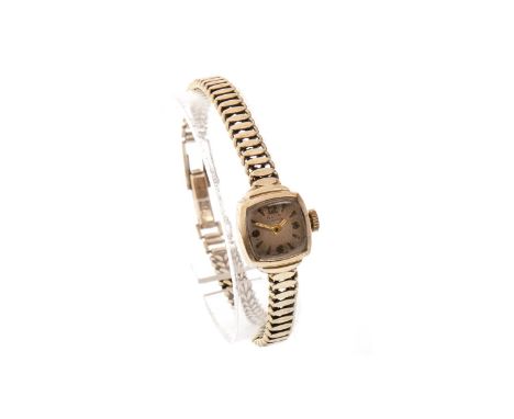 LADY'S NINE CARAT GOLD AVIA MANUAL WIND WRIST WATCH, the rounded square dial with applied Arabic numeral and baton hour marke