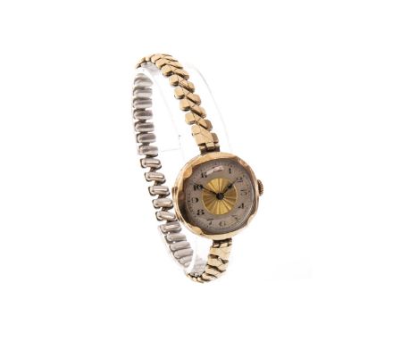 LADY'S EARLY TWENTIETH CENTURY NINE CARAT GOLD MANUAL WIND WRIST WATCH, unsigned 15 jewel movement, the round dial with centr