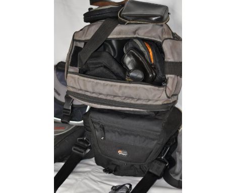 A large assortment of camera bags