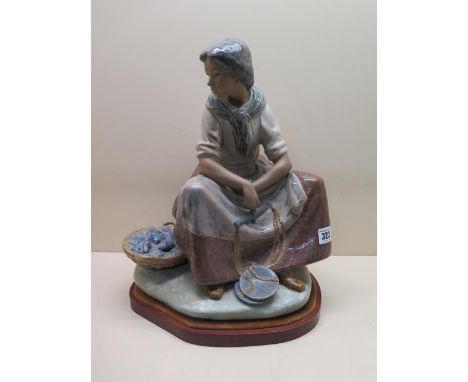 A Lladro Vincente Martinez figure, The Fisherwoman, issued 1978 retired 1985, 40cm tall, on stand in good condition, no box o