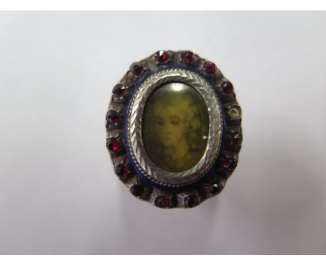 A white metal locket ring, size K, missing a stone and some usage marks, otherwise generally good 