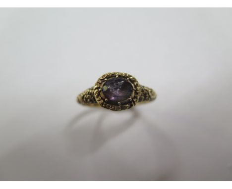 A yellow gold amethyst ring, size Q, approx 2.9 grams, tests to approx 9ct, chip to stone otherwise generally good 