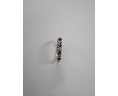 A 9ct yellow gold seven stone diamond and sapphire ring, size K, approx 1.4 grams, in good condition 