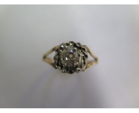 A yellow gold diamond cluster ring, missing 8 small diamonds, some wear to shank, ring size N, approx 2 grams 