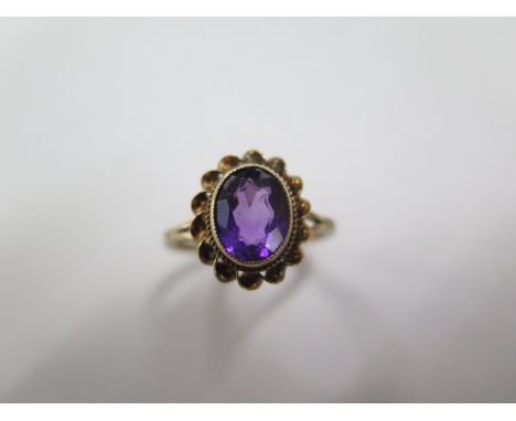 A hallmarked 9ct yellow gold oval amethyst ring, size P, approx 2.8 grams, in generally good condition 