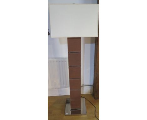 A designer chrome and leather effect standard lamp, matching previous lot 