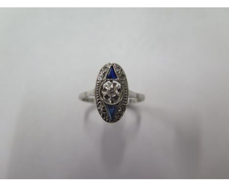 An Art Deco Navette shaped diamond and sapphire white metal ring possibly platinum, size R, approx 3 grams, some usage wear c
