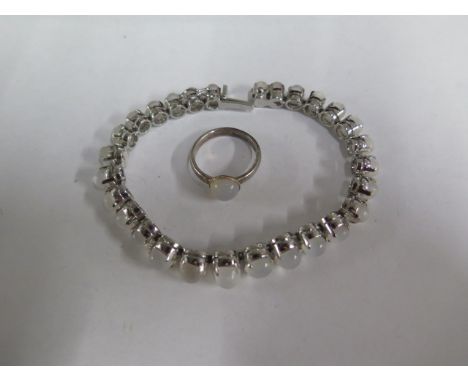 A moonstone bracelet, 18cm long, and a ring, size N 