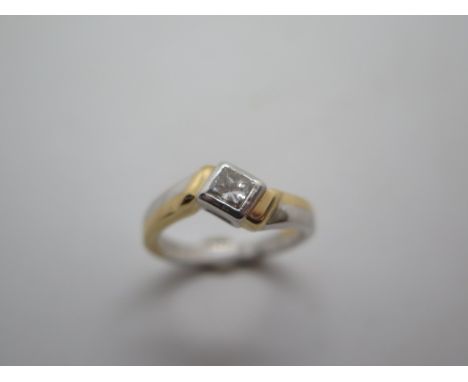 A hallmarked 18ct white and yellow gold diamond solitaire ring, square cut diamond approx 4mm x 3mm, size M, in good conditio