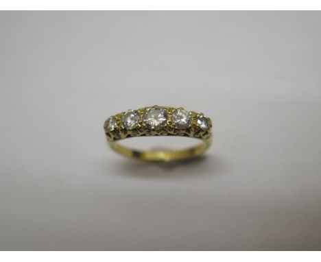 An 18ct yellow gold five stone brilliant cut diamond ring, central diamond approx 3mm x 2.3mm, size L, in good condition, dia