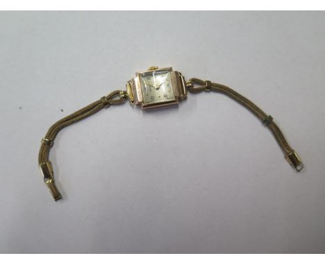 A 9ct gold Helvetia ladies manual wind wristwatch on a rolled gold strap, case 16mm, total weight approx 12.7 grams, running 