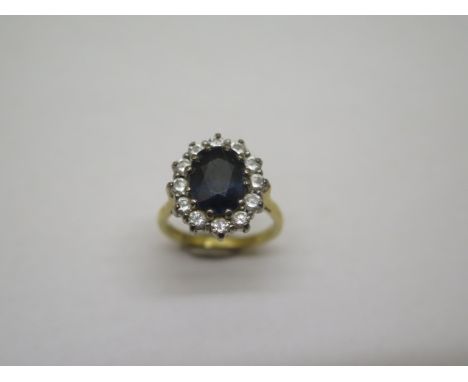 A hallmarked 18ct yellow gold sapphire and white stone ring, size J, approx 5.5 grams, some abrasions but generally good 