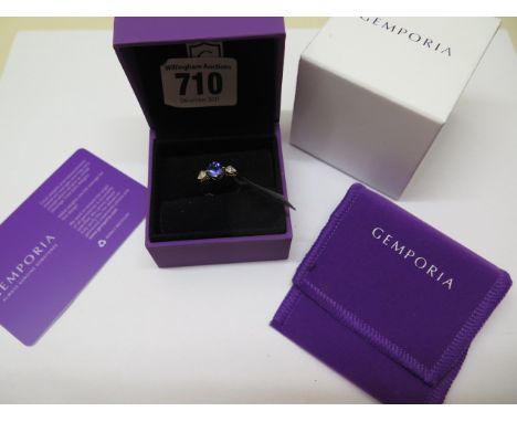 An 18ct gold Gemporia tanzanite and diamond ring, size L/M, gold weight approx 2.9 grams, unworn with certificate, box and po