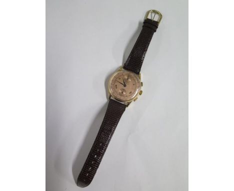 An 18ct Swiss chronograph gents manual wind wristwatch on leather strap, 36mm case, in working order, some small dents consis