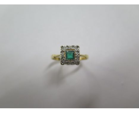 An 18ct yellow gold emerald and diamond ring, size R, approx 2.4 grams, some wear but generally good 