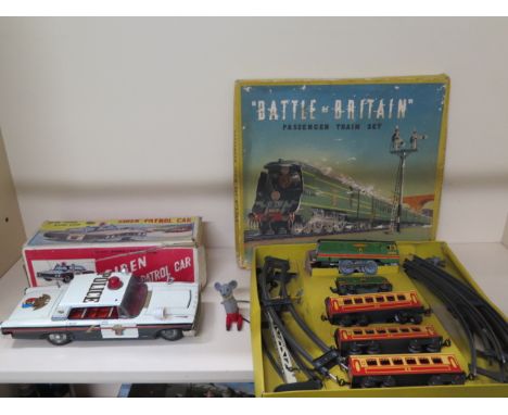 A tinplate battery operated siren patrol car and a clockwork mouse, car missing a roof lamp, box torn, not tested, mouse not 