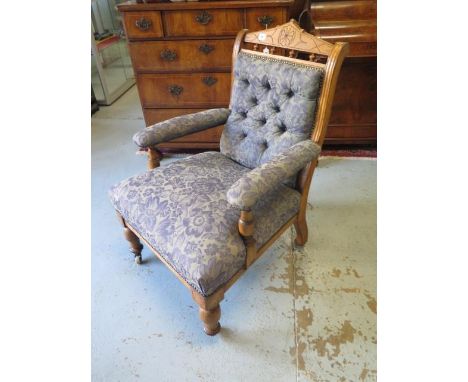 A Victorian Oak button back fireside chair , recently reupholstered 91 cm tall 