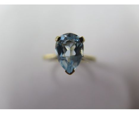 A gold blue topaz tear drop ring, size J/K, tests to approx 9ct, approx 2.9 grams, stone measures 10mm x 7mm x 5mm, in good c