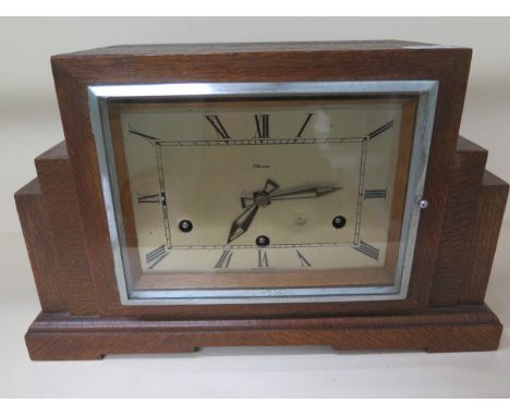 An oak case 8 day mantle clock Art Deco by Clarion with full Westminster chimes, in running order, 22cm tall 